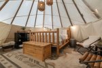 Inside the teepee is a comfortable Queen bed & furniture